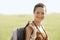 Female Hiker With Backpack In Field