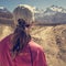 Female hiker deciding which path to take.