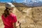 Female hiker deciding which path to take.