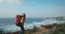 Female hiker in epic cinematic coast scenery
