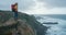 Female hiker in epic cinematic coast scenery