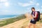 Female hiker holding map studying hiking route