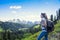 Female Hiker in the mountains looking at a scenic view of Mount Rainier