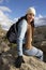 Female Hiker Relaxing On Rock