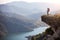 Female hiker standing on cliff