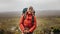 Female hiker standing on a hill