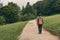 Female hiker walking on footpath outdoors