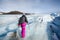 Female hiker walking on glacier at Solheimajokull