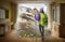 female hiker in warm clothing with backpack and hiking equipment dreaming