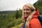 Female hiker wearing a rain jacket enjoys the views in Seward Alaska