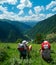 Female hikers rest and enjoy landscape