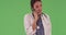 Female Hispanic medical professional talking on mobile cell phone green screen