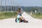 A Female Hitchhikes On A Dirt Road