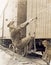 Female hobo climbing freight train