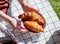 Female holding a plate with croissants over checked litter