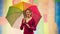 Female is holding the rainbow LGBT flag. Charming cheerful attractive nice cute girlfriend with umbrella.