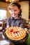 Female holds up a breakfast food waffle with a fork. Intentionally blurred background with focus only on the waffle