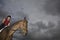 Female Horseback Rider Sitting On Horse