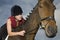 Female Horseback Rider Sitting On Horse