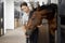 Female horseman feeding her horse in stable