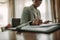 Female at hotel room desk making notes