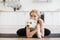 Female hugging small dog during yoga workout at home