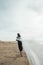 female independence woman walking away desert sky