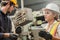 Female industrial engineer wearing a white helmet