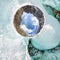 Female inside the crack in the ice glaciers Iceland. spherical 360 180 panorama of little planet