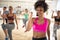 Female instructor with headset in fitness class