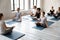Female instructor teaching diverse people, practicing yoga, doing Padmasana exercise