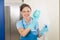 Female Janitor Cleaning Glass