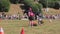 A female jockey races a hurdle-jumping horse at the Riding Championships, Grudziadz, Poland - June 18, 2023