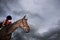 Female Jockey Riding On Horse