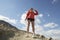 Female jogger Drinking From Water Bottle In Mountains