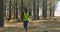 Female jogger running in the forest 4k