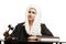 Female judge wearing a wig and black mantle with judge gavel and