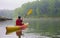 Female kayaker on lake