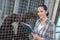 Female kennel employee checking dogs state