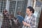 Female kennel employee checking dogs state