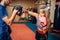 Female kickboxer on workout with personal trainer