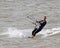 Female kite surfer at sea