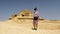 Female Korean tourist at Gebel Al Mawta, the `Mountain of the Dead`, in Siwa Oasis, Egypt.