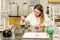 Female laboratory technician researching medical samples and reagents for coronavirus vaccination