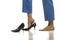 Female lags in blue trousers wearing high heels