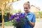 Female Landscape Gardener Holding Plant