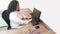 Female latin female doctor sitting looking at the screen in her office with stethoscope at the desk typing on her computer