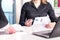 Female lawyer and attorney pointing a legal document in meeting