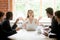 Female leader meditating ignoring angry coworkers