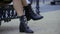 Female legs in black shoes
